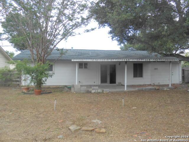 back of property with a patio