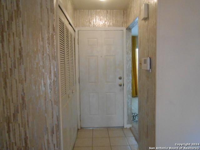 hall with light tile patterned flooring