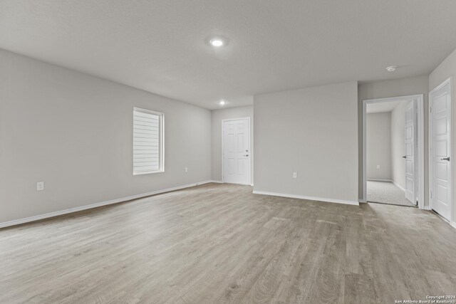 kitchen featuring stainless steel appliances, light hardwood / wood-style floors, gray cabinetry, and sink