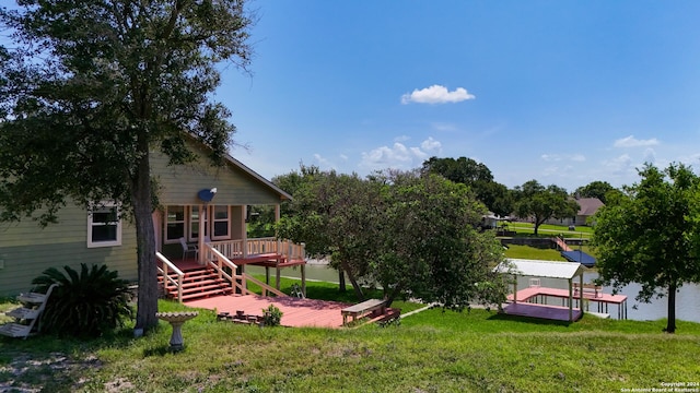 view of yard with a wooden deck