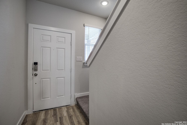 doorway to outside featuring hardwood / wood-style flooring