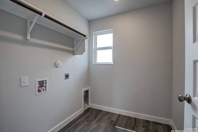 laundry area with washer hookup, dark hardwood / wood-style flooring, hookup for an electric dryer, and hookup for a gas dryer