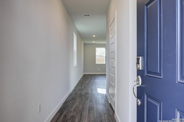 corridor with dark wood-type flooring