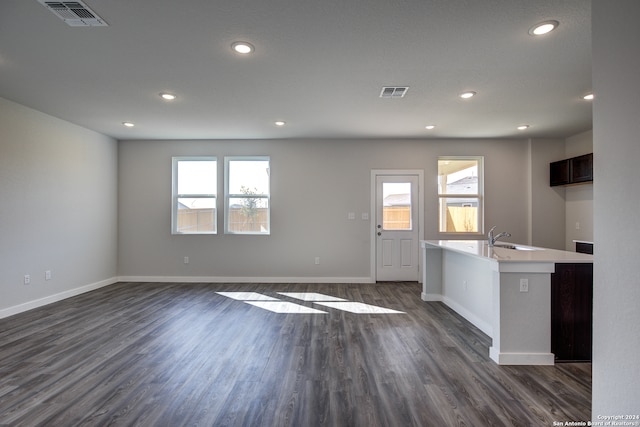 interior space with sink and dark wood-type flooring