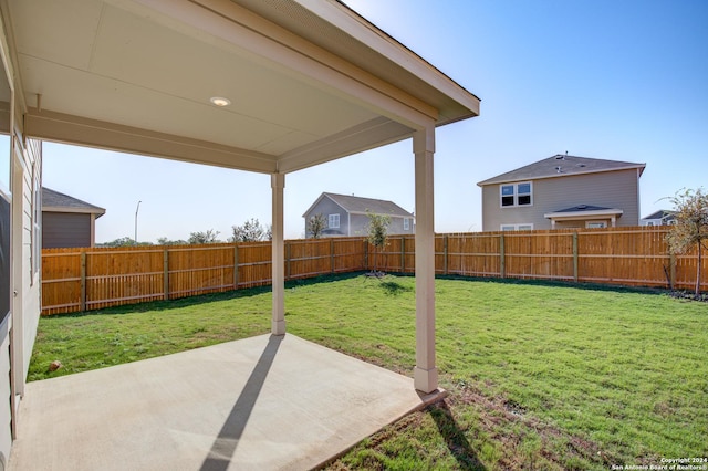 view of yard with a fenced backyard and a patio