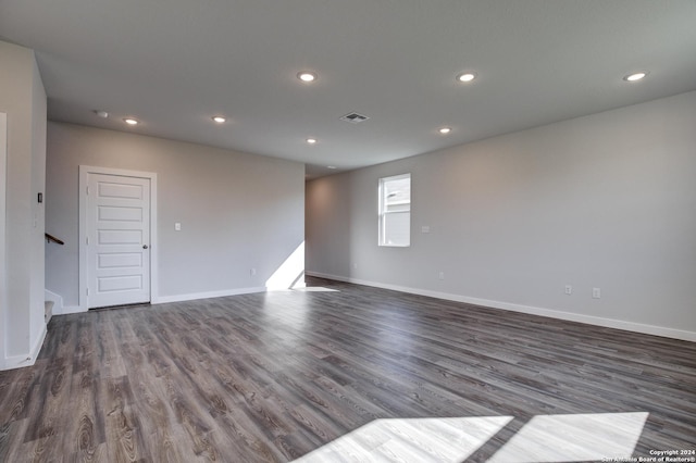 unfurnished room with stairs, baseboards, dark wood-style flooring, visible vents, and recessed lighting