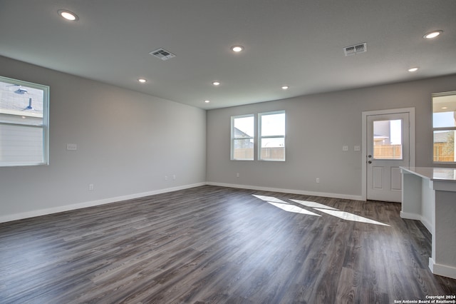 spare room featuring dark wood-type flooring