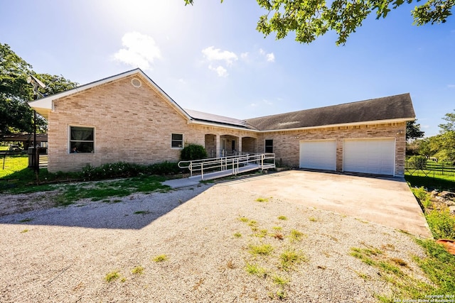 ranch-style house featuring a garage