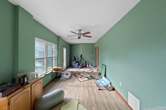 bedroom featuring ceiling fan and light hardwood / wood-style floors