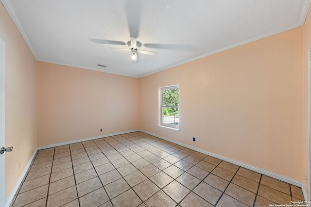 tiled empty room with ceiling fan and crown molding