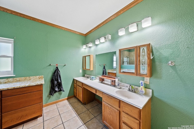 bathroom with tile patterned floors, crown molding, and vanity