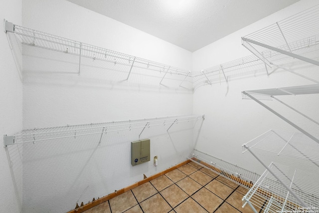 spacious closet featuring tile patterned floors