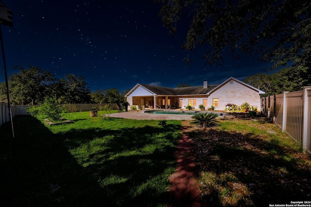 view of yard at night