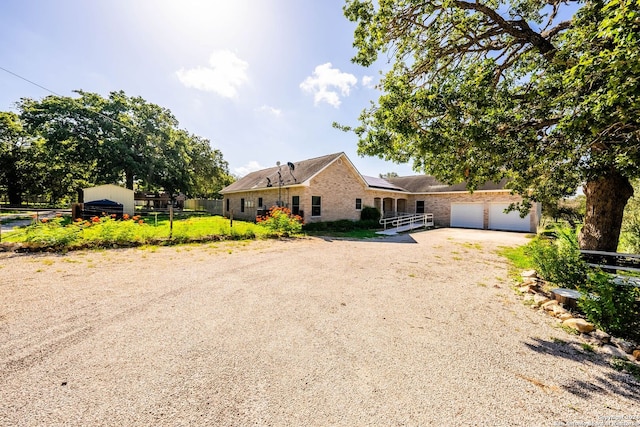 ranch-style home with a garage