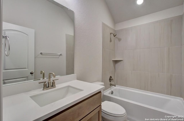 full bathroom with vanity, toilet, shower / bathtub combination, and lofted ceiling