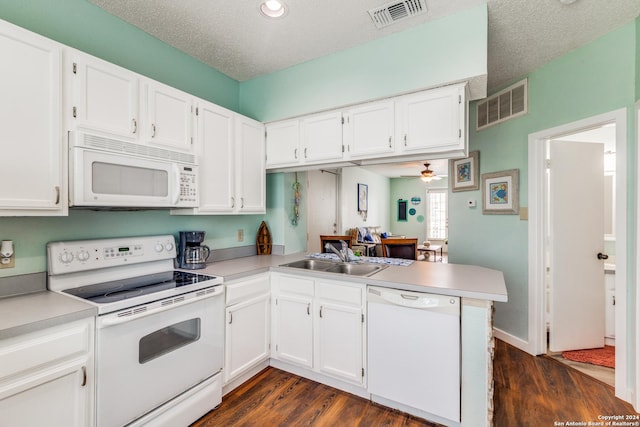 kitchen featuring sink, white appliances, dark wood-type flooring, white cabinetry, and kitchen peninsula