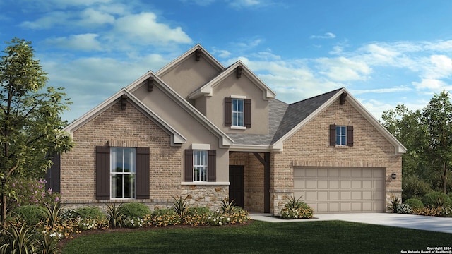 view of front of home featuring a front lawn and a garage