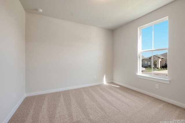 unfurnished room featuring carpet floors