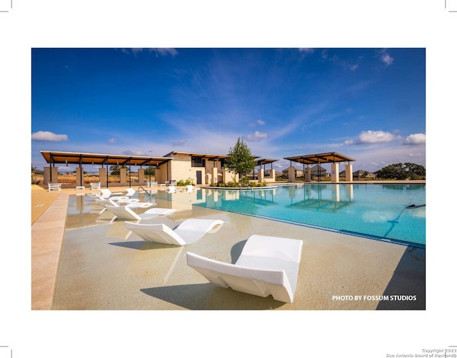 view of pool with a patio and a gazebo