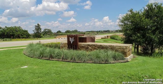 view of community featuring a lawn