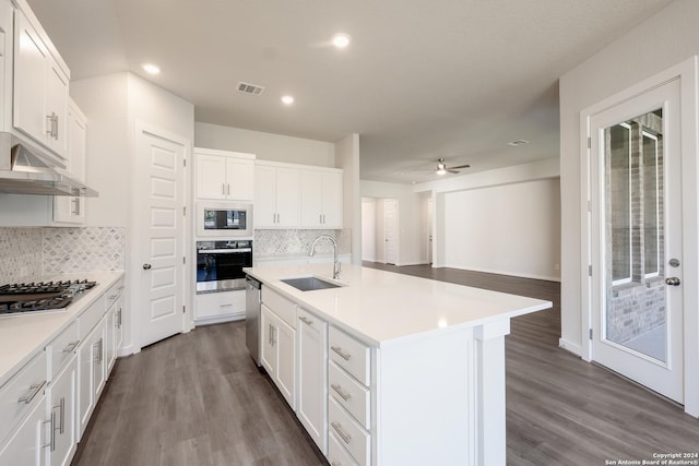 kitchen featuring white cabinetry, sink, a center island with sink, and appliances with stainless steel finishes