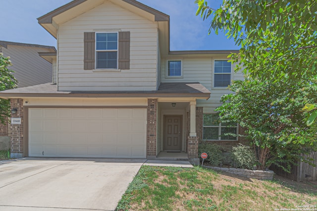 front facade with a garage