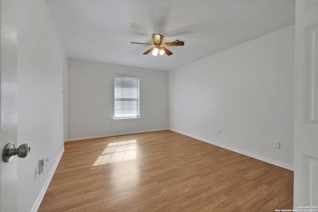 empty room featuring ceiling fan and light wood-type flooring