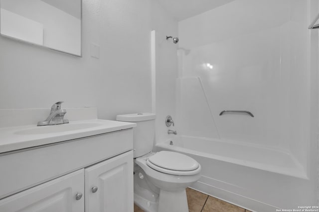 full bathroom with tile patterned flooring, vanity, shower / washtub combination, and toilet