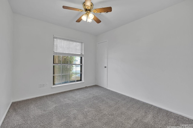 empty room with carpet and ceiling fan