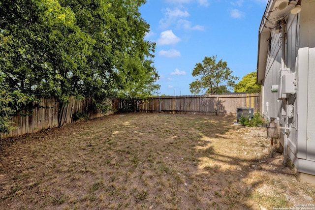 view of yard featuring central air condition unit