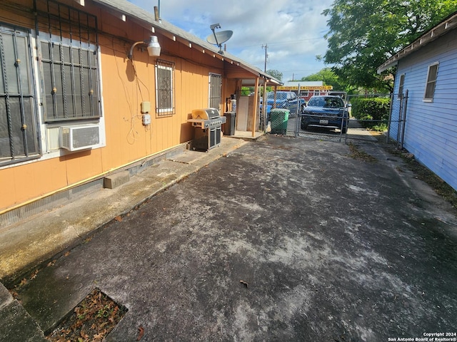 view of side of property with cooling unit