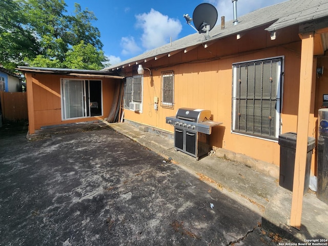 back of property featuring a patio area and cooling unit