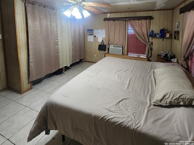 tiled bedroom with wooden walls, cooling unit, and ceiling fan