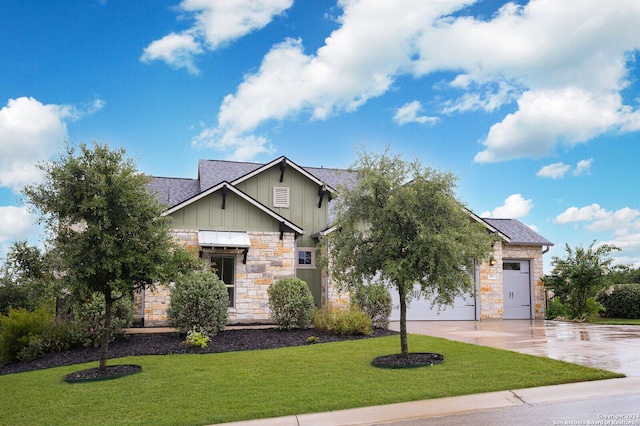 view of front of property featuring a garage and a front lawn