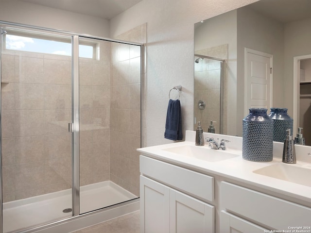 bathroom with walk in shower and vanity