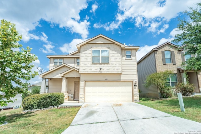 view of front of property with a garage and a front lawn