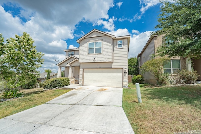 view of front of property with a garage and a front yard