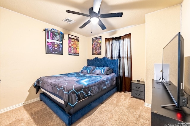 bedroom featuring ceiling fan and light colored carpet