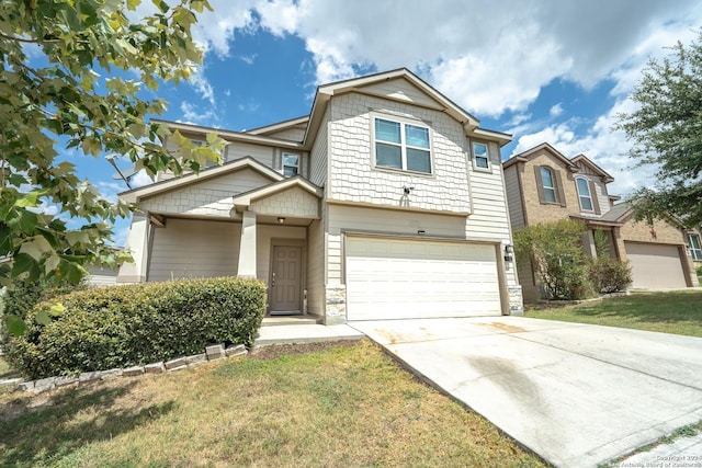 view of front of property featuring a garage and a front yard