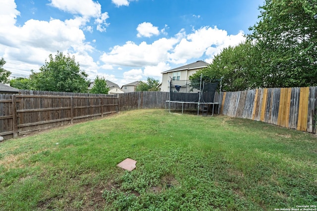 view of yard featuring a trampoline