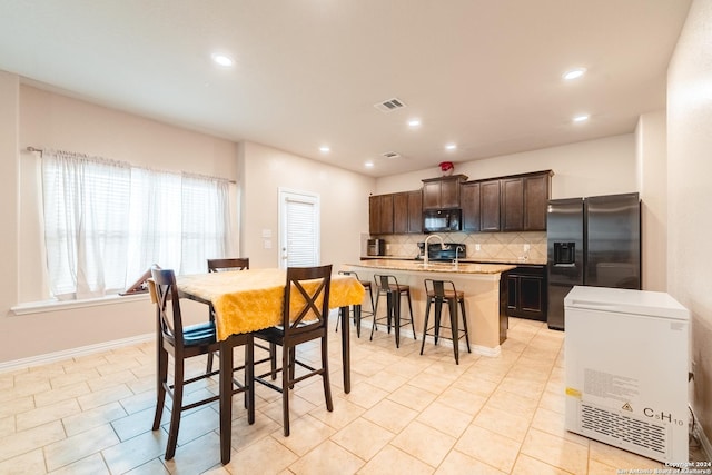 tiled dining space with sink