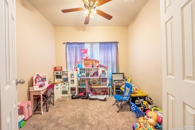 rec room featuring ceiling fan and carpet