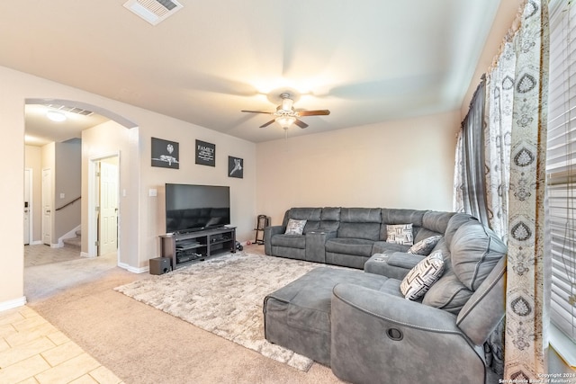 living room with light colored carpet and ceiling fan