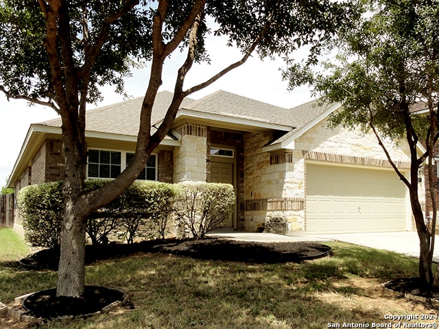 ranch-style home featuring a garage