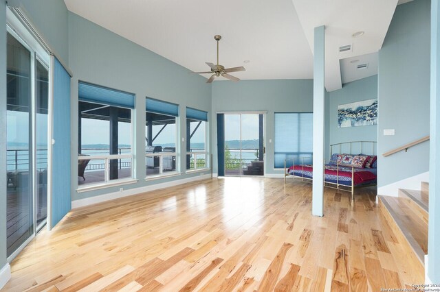 living room with light hardwood / wood-style flooring and ceiling fan