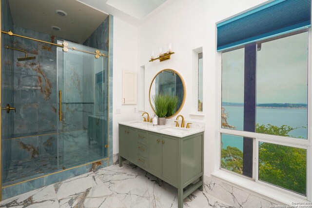 bathroom with a shower with shower door, tile patterned flooring, and double sink vanity