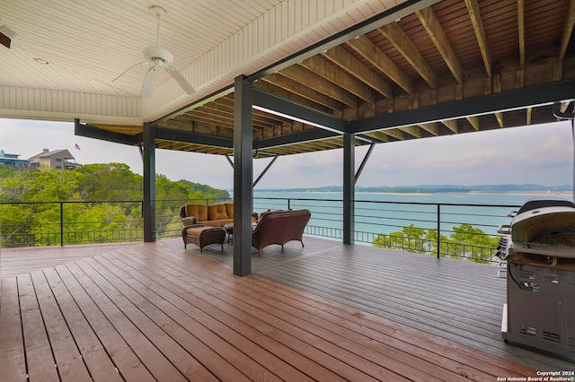 wooden deck featuring a water view and area for grilling