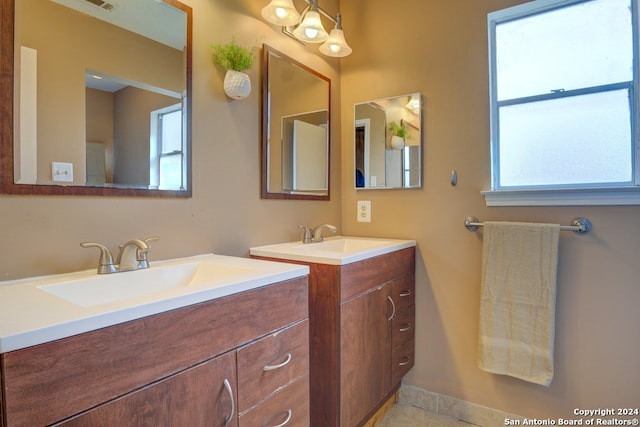 bathroom featuring dual vanity