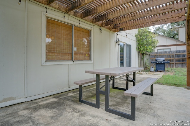 view of patio / terrace with a grill and a pergola