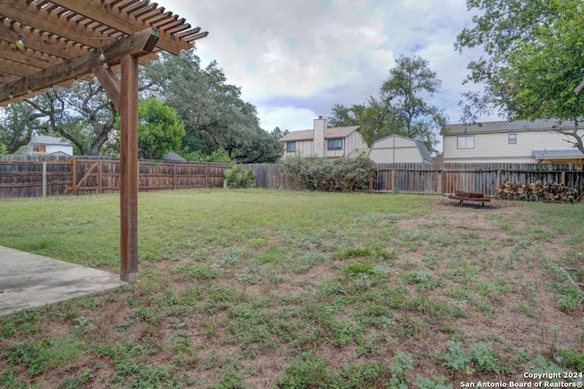 view of yard with a fire pit